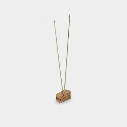 Beadsology bead embroidery kit includes a beading needle inserted into a small cork block for display.